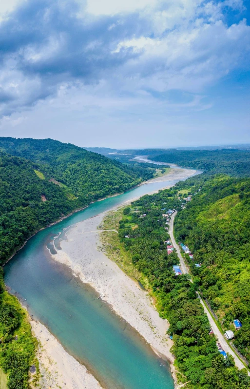 an aerial view shows the river near a mountainous area