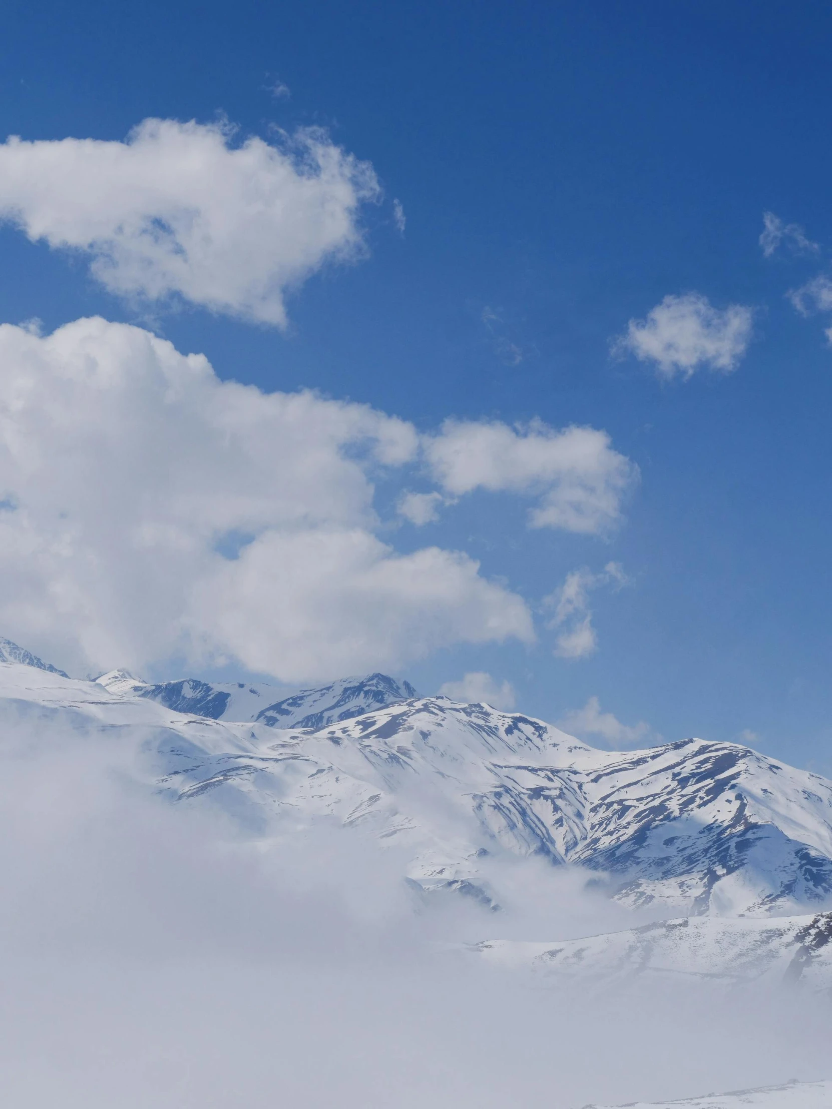 the view of a mountain that is covered in snow