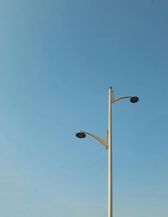 the street light is attached to the lamp pole