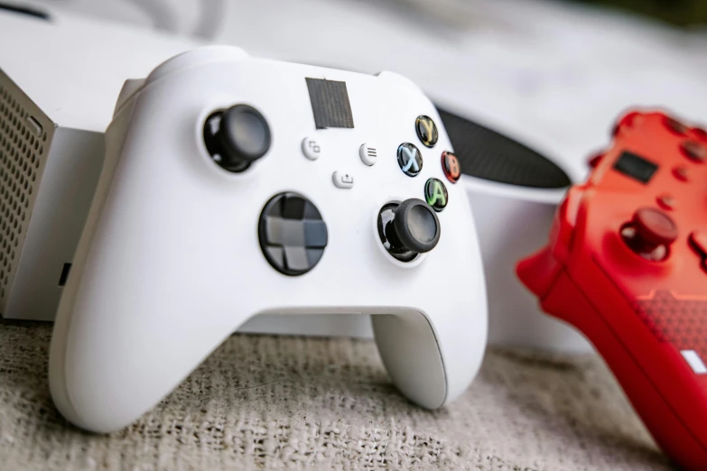 a video game controller sitting on top of a bed