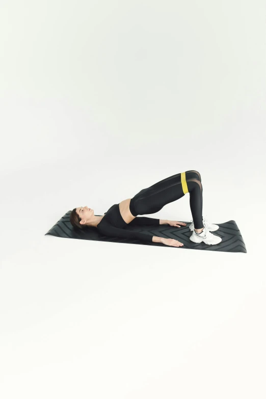 a young woman doing a side plank yoga pose