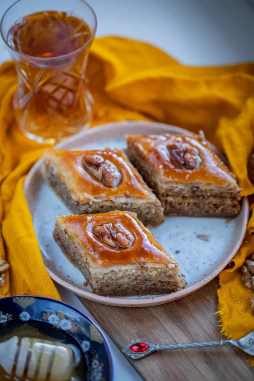 a plate with slices of cake and honey