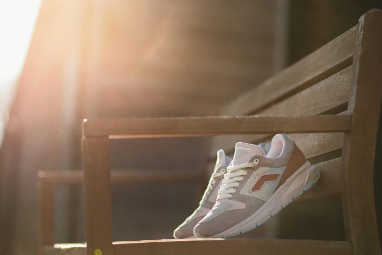 a tennis shoe is on top of a bench