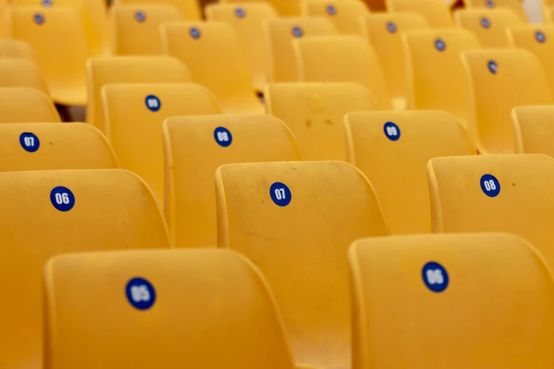 there are several rows of seats with numbers on them