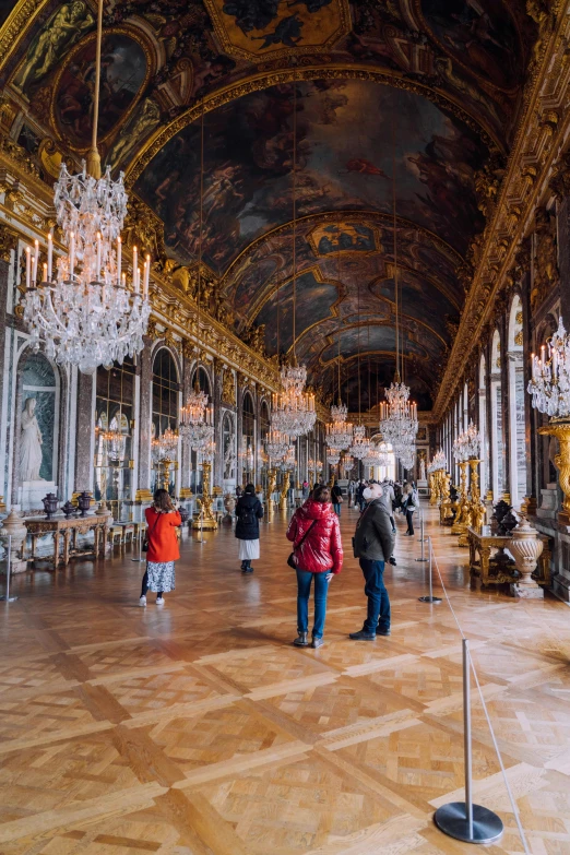 a palace with people looking at chandeliers