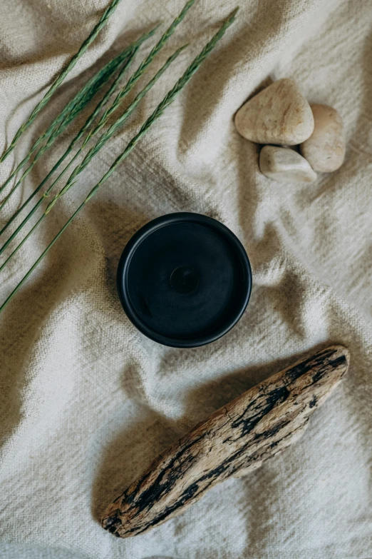 a close up of a plate and a wooden paddle on a sheet