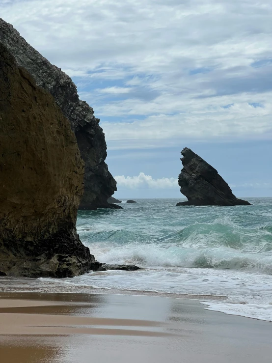 the shore line and sea are surrounded by cliffs