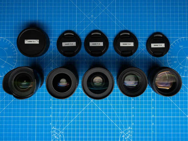 various lens options arranged on a blue surface