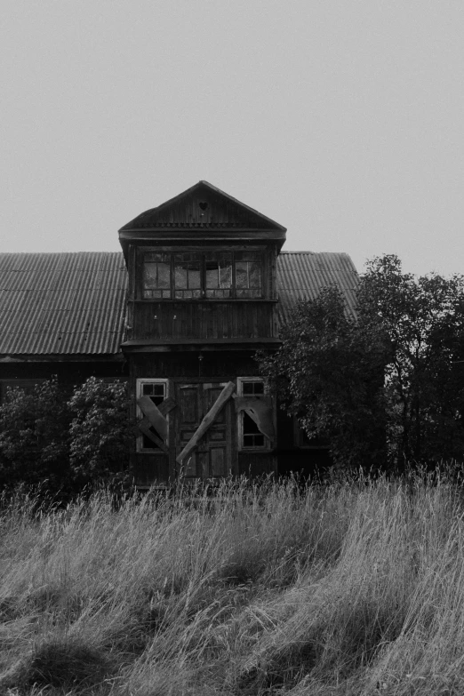 black and white po of a house in the middle of nowhere