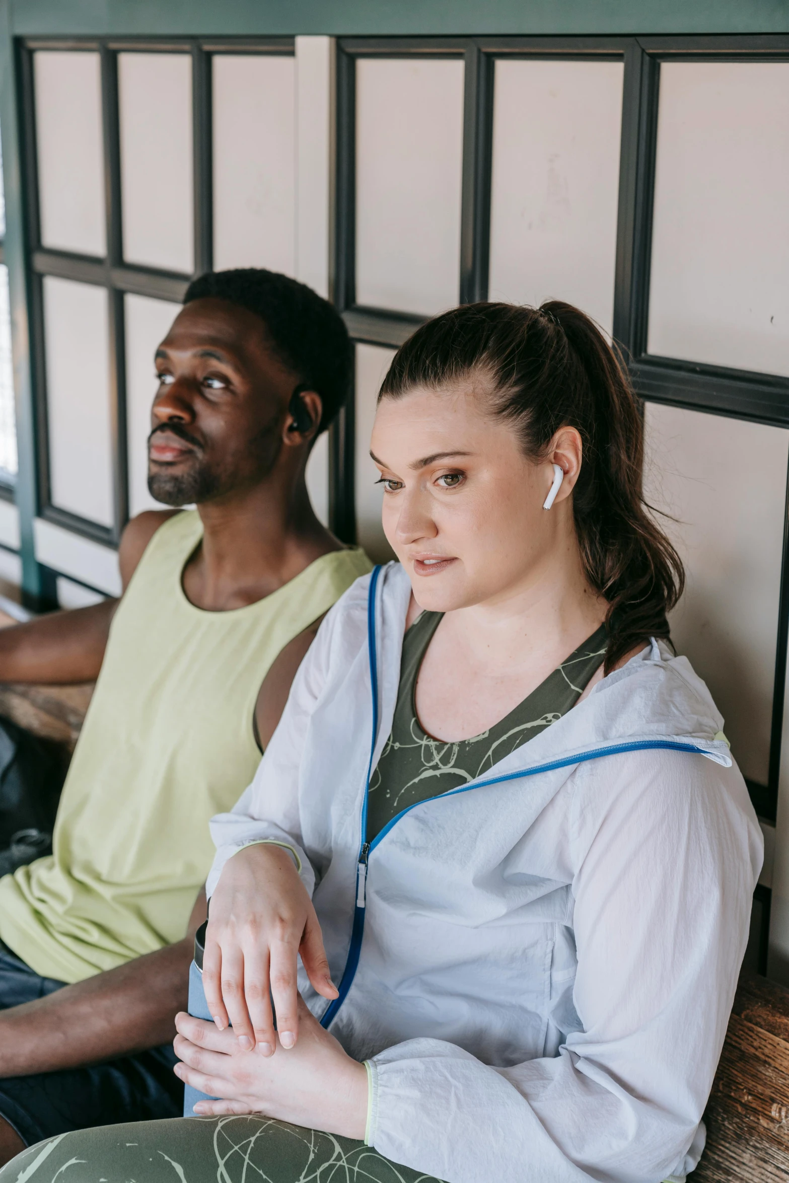 a man and woman sitting down and staring into each other's eyes