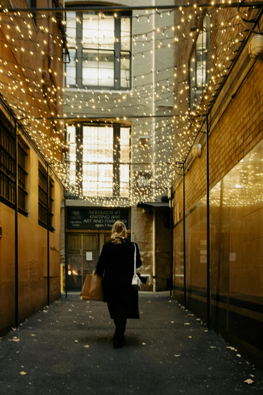 a person that is walking down a street