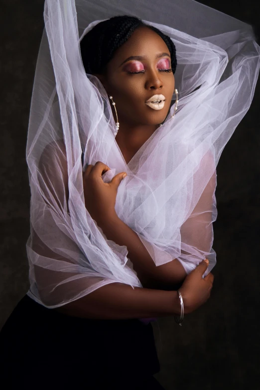 a woman with an unusual makeup and a veil around her head