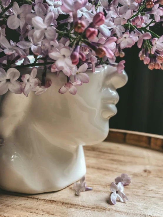 a vase is filled with flowers and sits on the table