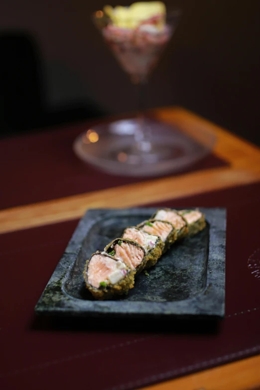 a plate of food and a glass on top of a table