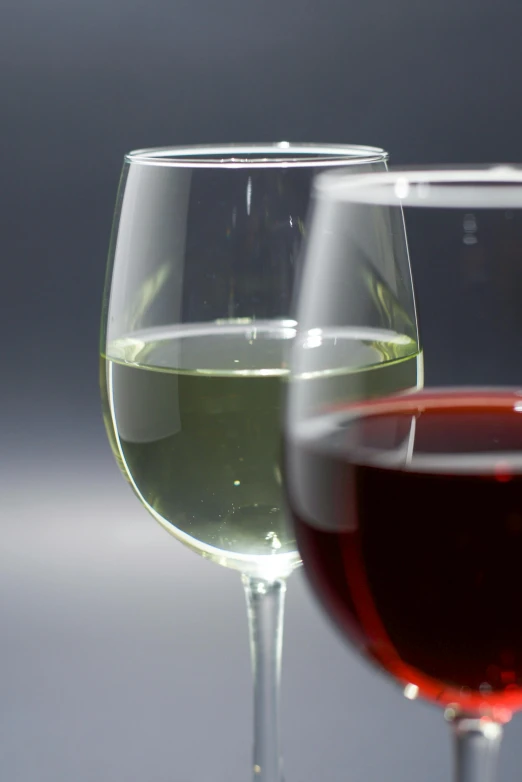 three wine glasses sitting side by side, ready for tasting