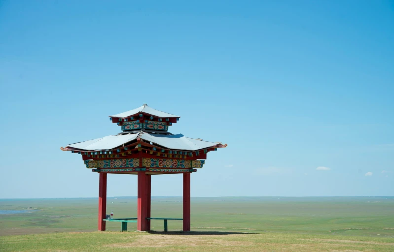 a pavilion that has a metal roof on top