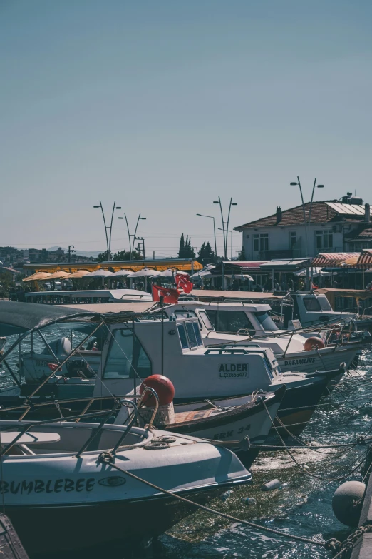 a group of small boats are docked in a harbor