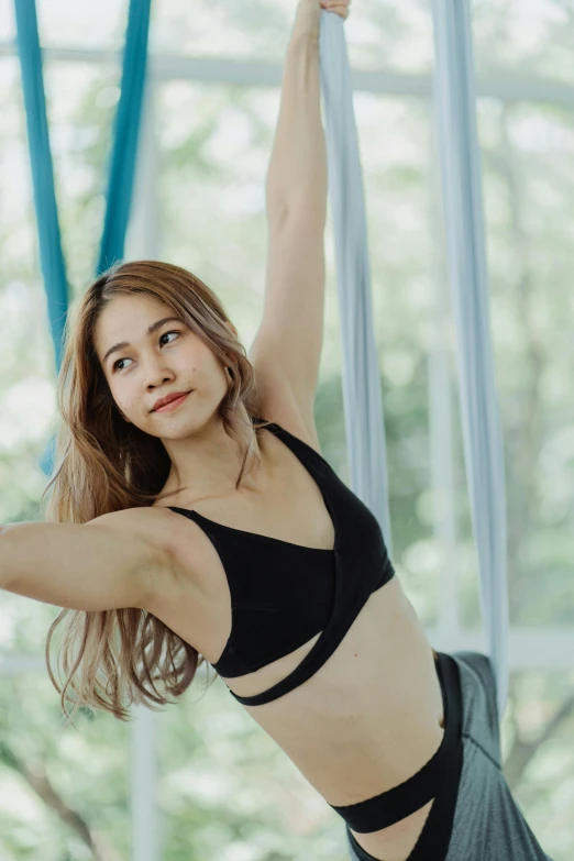 the girl is posing in the yoga position