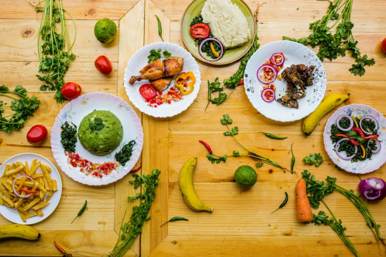 some different plates of food with tomatoes, broccoli, broccoli and noodles