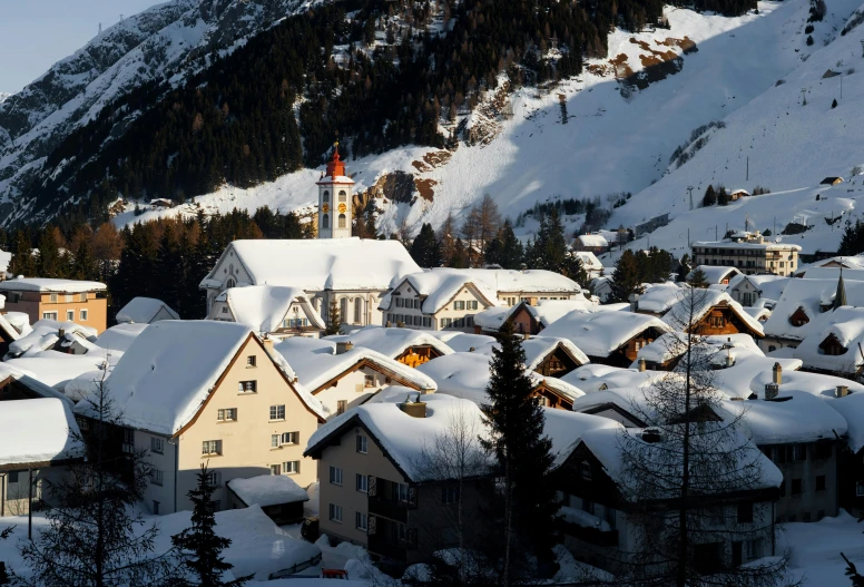 a snow covered village in the mountains