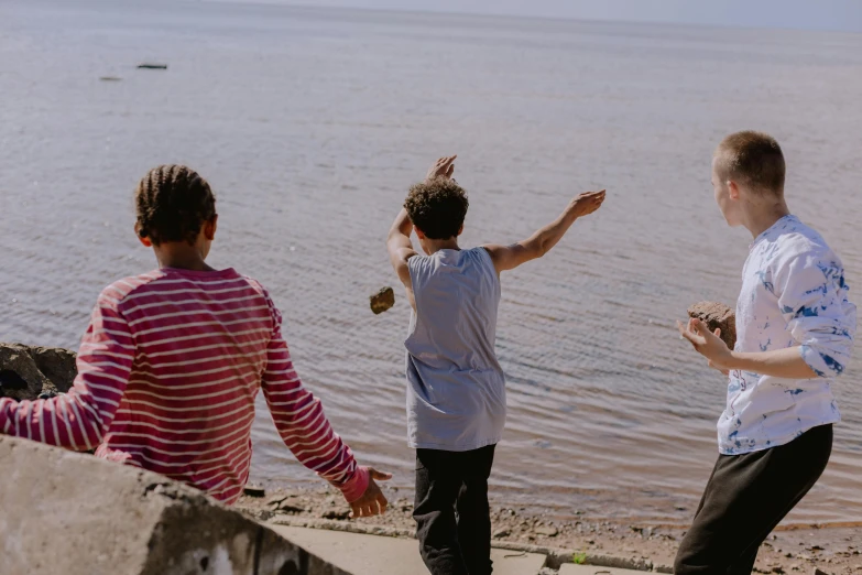 four people on the beach enjoying their time