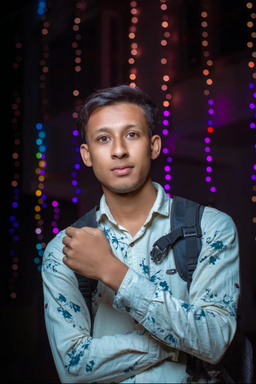 a man with a backpack posing for a picture