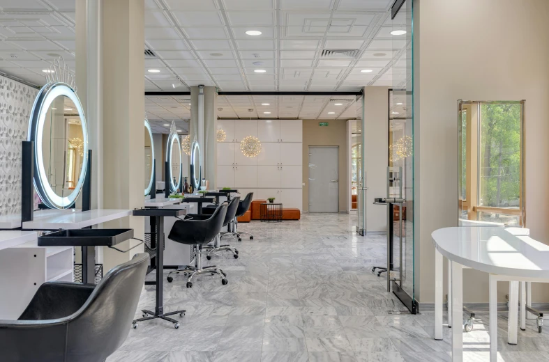 there are several chairs in the salon waiting for customers