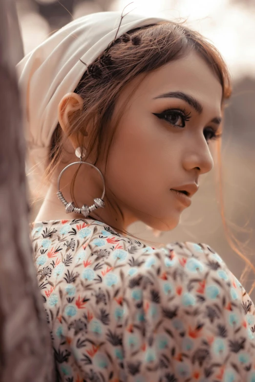 a woman with long hair wearing a headband