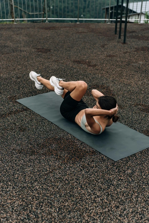 a person who is laying down on a yoga mat