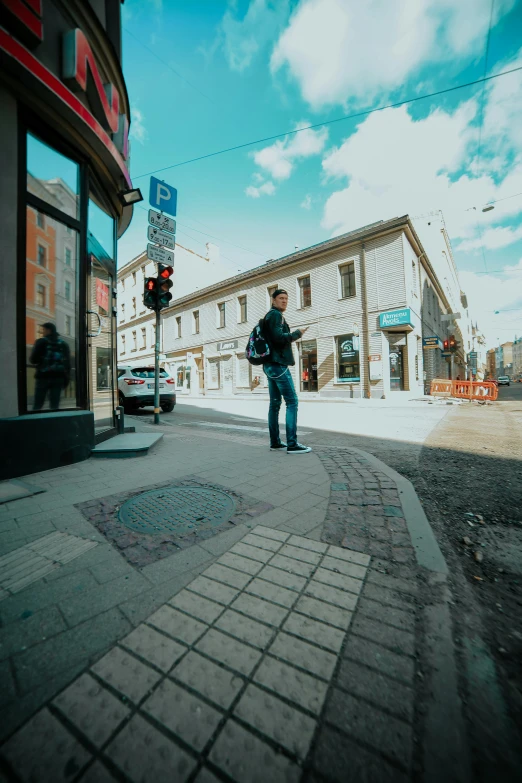 a man standing on the side of a street