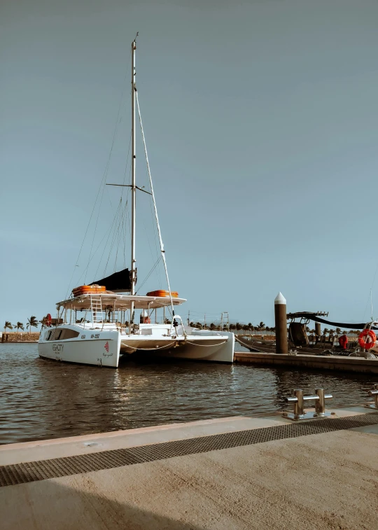 a boat is docked at the dock on the water