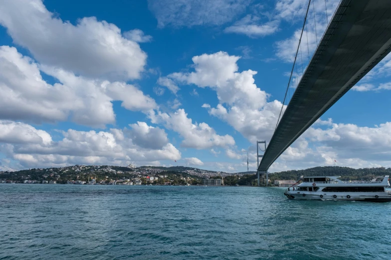 a large boat under the bridge and water