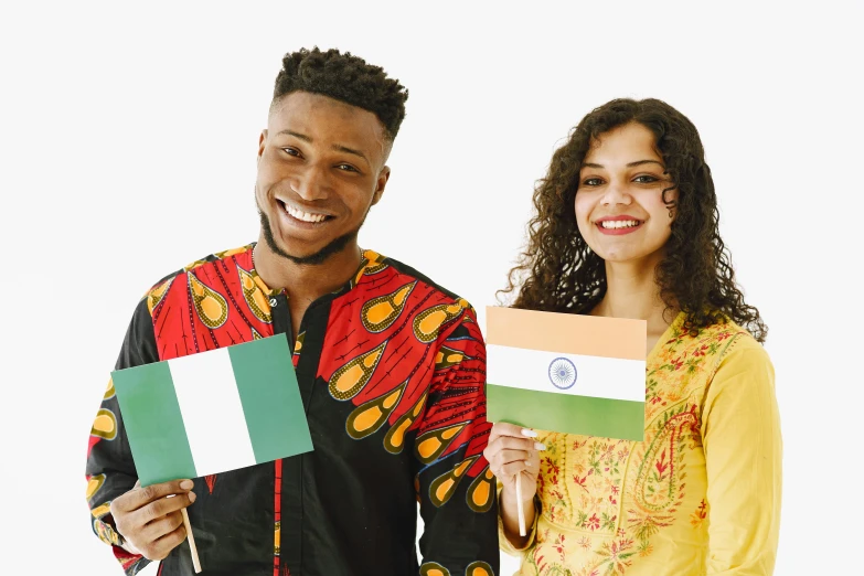 a man and woman are holding the colors of the flag