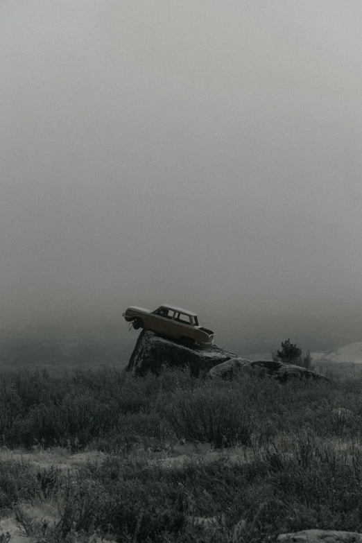 a plane is on its side in the grass