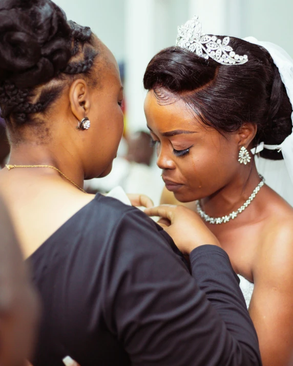 a bride and her maid in a traditional ceremony