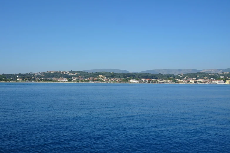 the ocean with a city in the distance