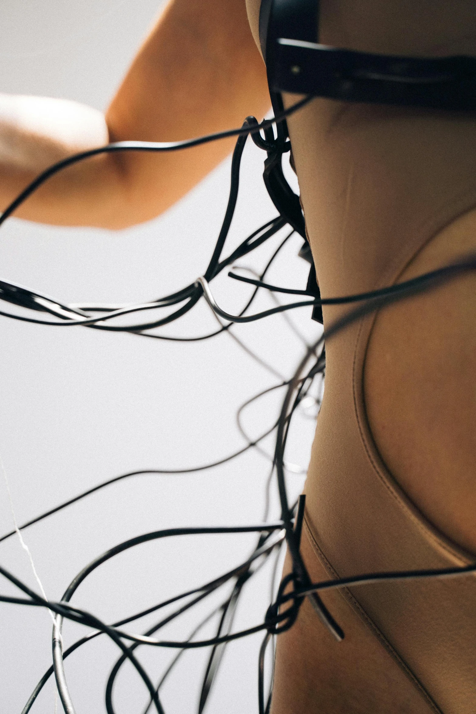 a woman has her underwear back with a bunch of wires on her body