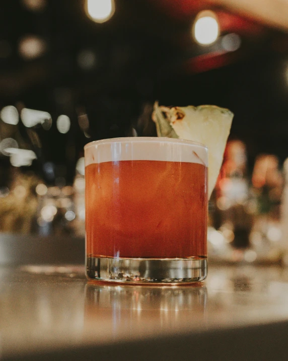 a tall glass on top of a table