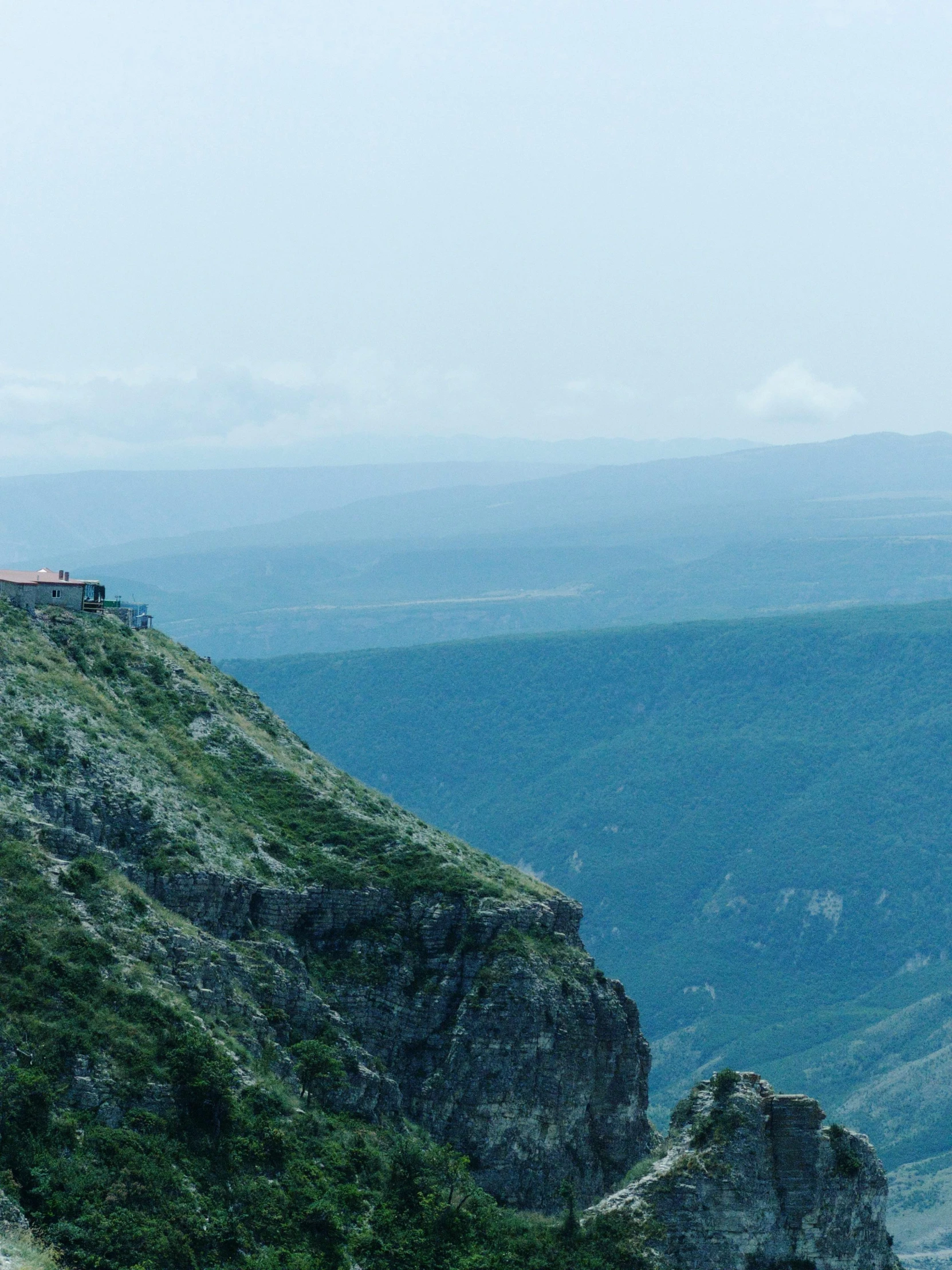 a hill with a train sitting on top of it