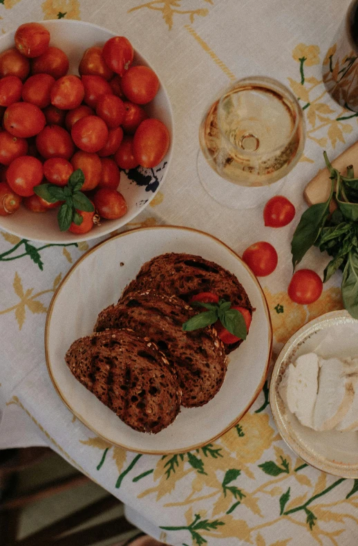 an arrangement of foods and vegetables on a table