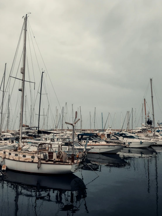 small sail boats in a large body of water