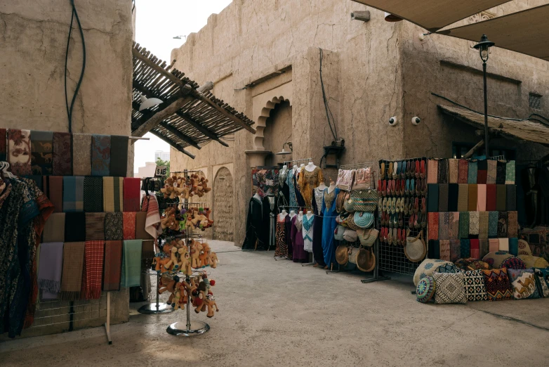 a group of stalls with umbrellas hanging outside