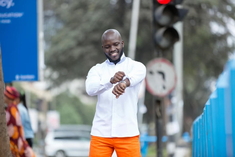 an image of a man in the street pointing out his hand