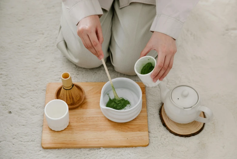 the woman is making tea for her self