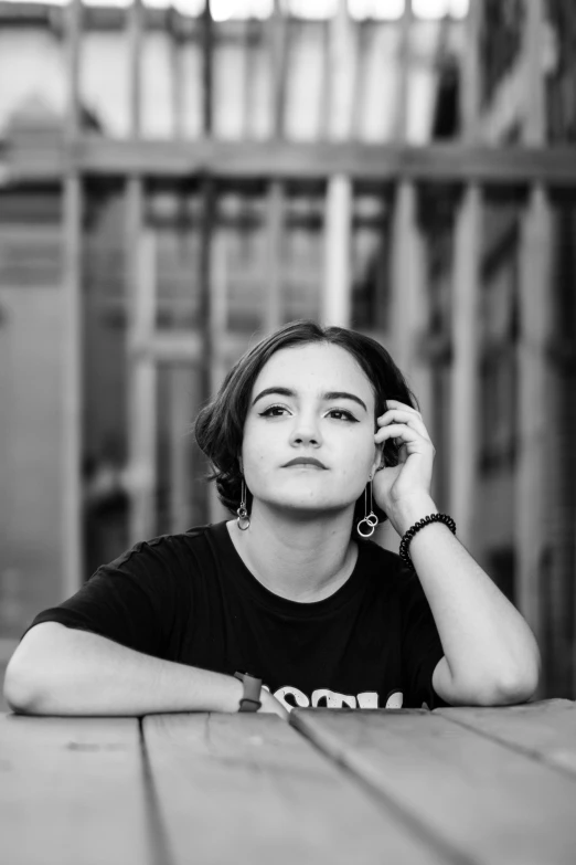 black and white pograph of a woman talking on a cell phone