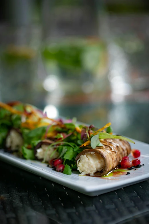 food item with vegetables and some sauce on plate