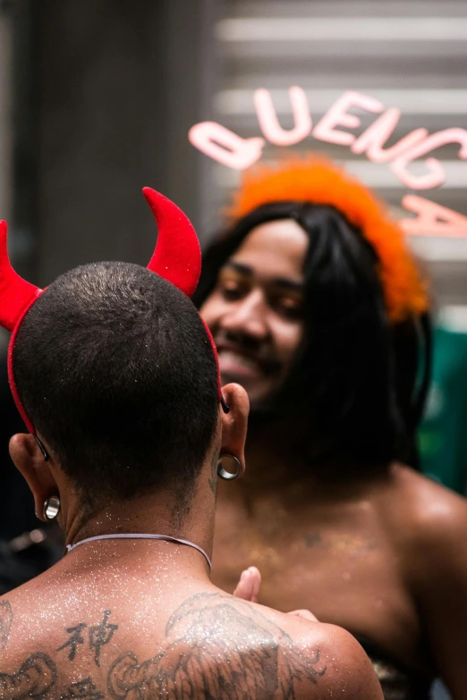 a man with a fake hairdo wearing an evil headband