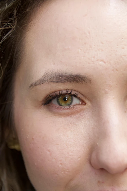 a closeup po of a woman's brown eyes