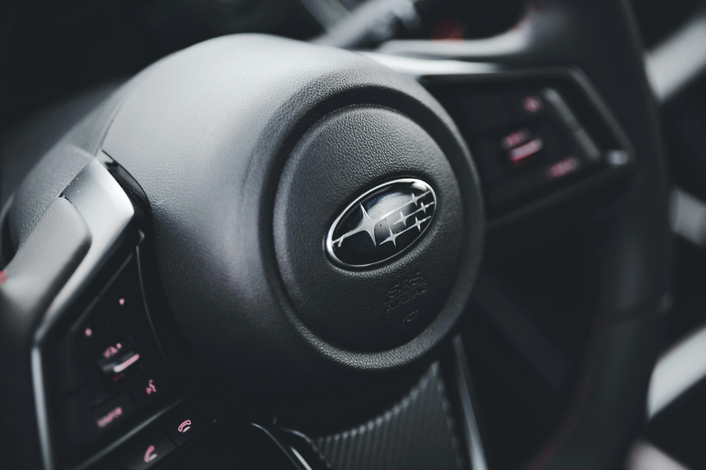 the dashboard view of a car with steering wheel