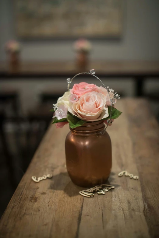 a vase of flowers sits on a table